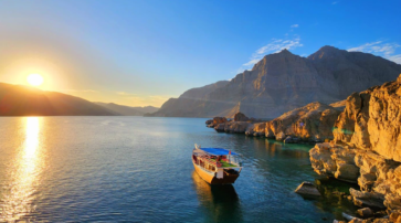 Sunset over the Musandam fjords on a dhow cruise