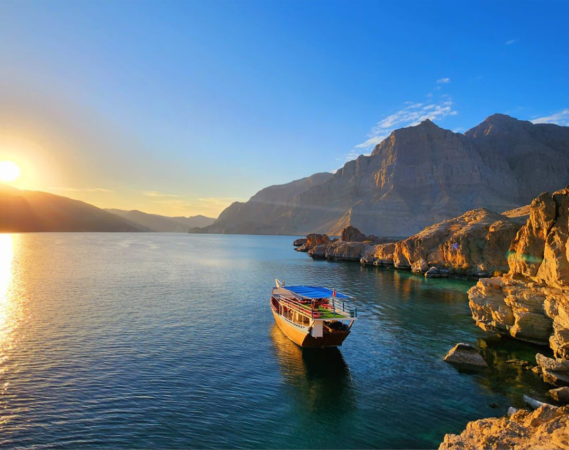 Sunset over the Musandam fjords on a dhow cruise
